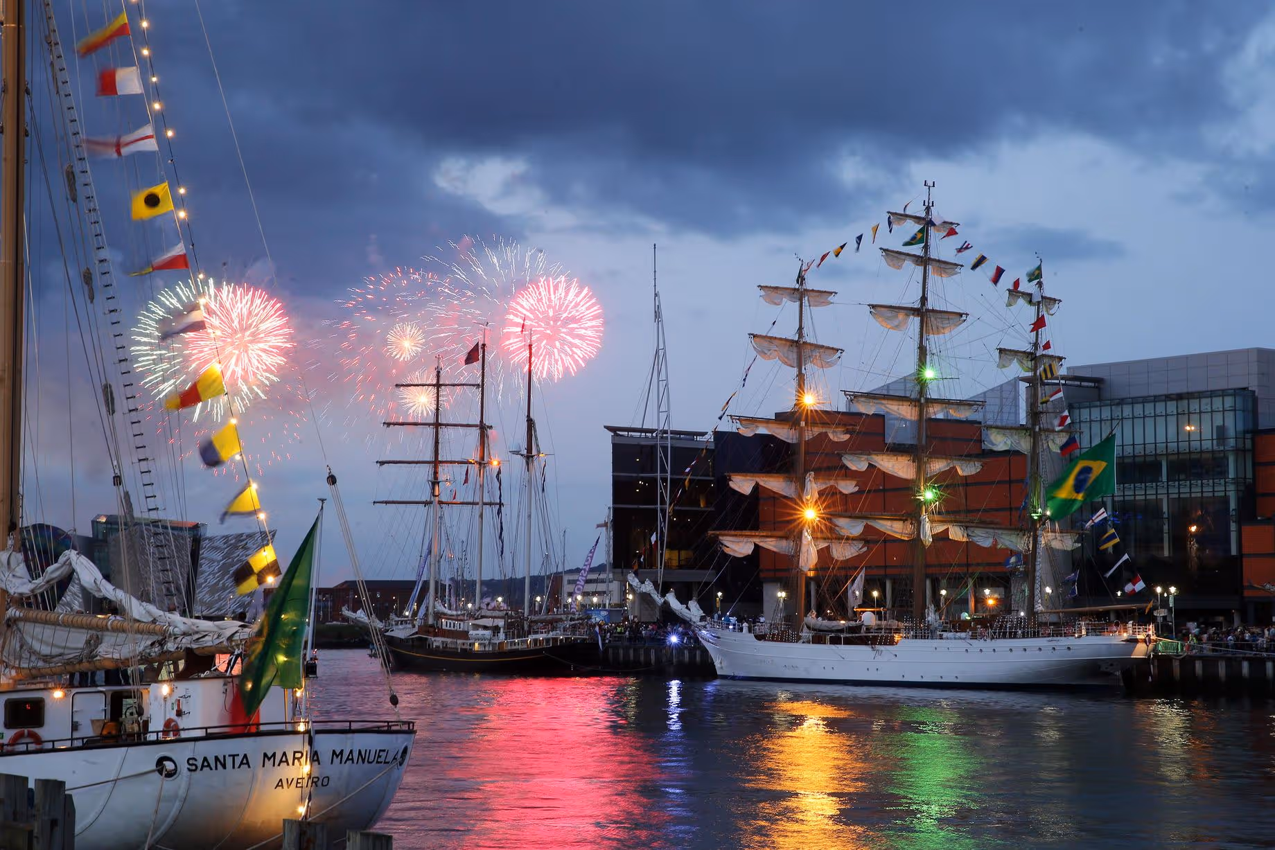 Fireworks over tall ships in Boston Harbor at Sail Boston 2026